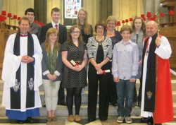 Dean John Mann and the Bishop of Connor with new and completing organ scholars.